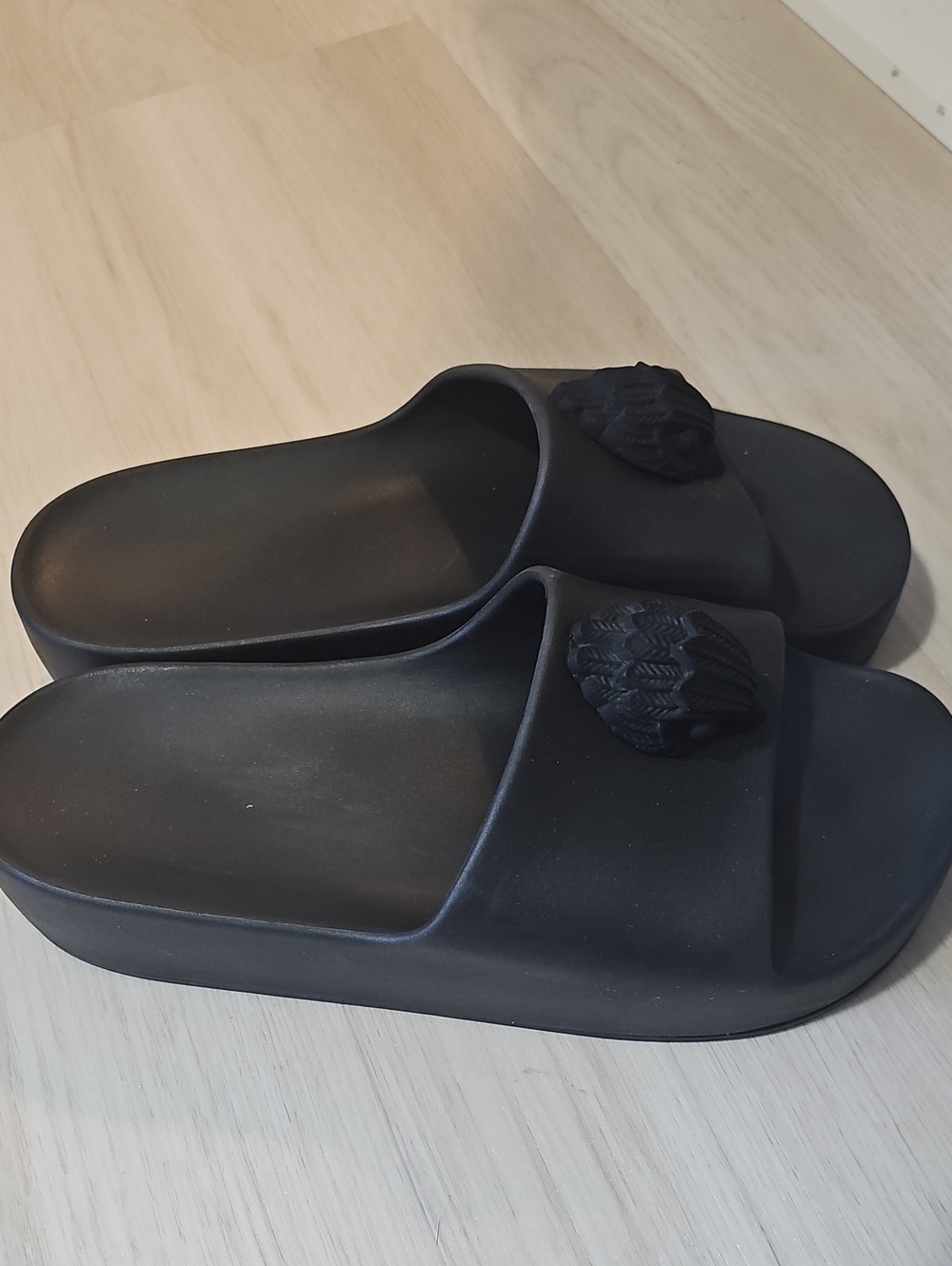 Kurt Geiger Black Slide Sandals with Textured Medallion